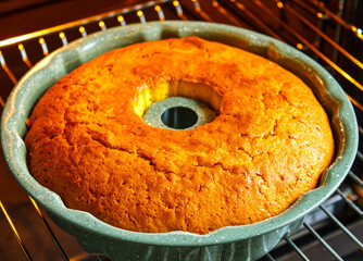 Christmas or New Year's cake, cooking. Ready-made pastries in a home oven. Freshly made Christmas cupcake or cake.