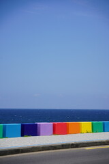 Blue sea and rainbow guardrails.