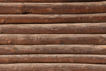 Wall surfaces made of brown wooden logs