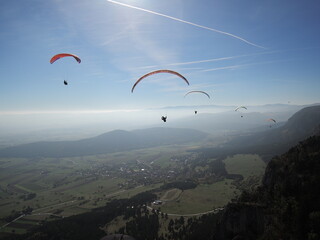 beauty of Paragliding flying, freeflying and powered paragliding in scenic nature aerial...