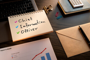 There is notebook with the word Chief Information Officer. It is as an eye-catching image.