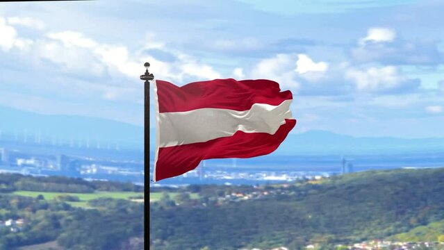 The flag of Austria on the flagpole flies against 