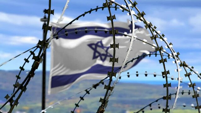 Barbed wire, flag of Israel on flagpole in defocus