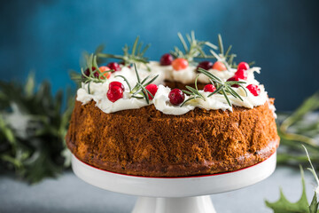 Chocolate covered Christmas cake with Christmas tree branches