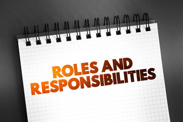 Roles And Responsibilities text on notepad, concept background