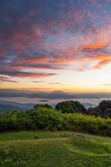Obraz premium Mountain and sea of fog sunrise surrounded with mountain and forest at Huai Nam Dang National Park. The Spectacular sea of mist and Doi Luang Chiang Dao mt. in Chiang Mai, Thailand