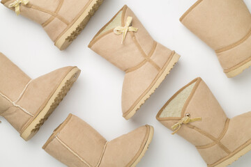 Many woman boots on color background,top view