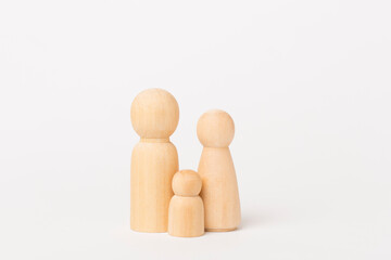 Wooden family figures on color background