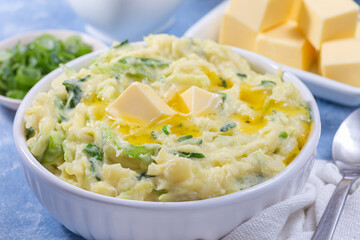 Delicious homemade Irish dish Colcannon or mashed potato with green cabbage, horizontal closeup
