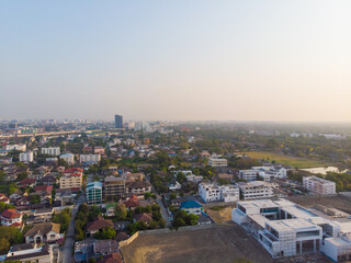 Obraz premium Aerial view office building with city road morning sun rise