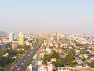 Fototapeta na wymiar Aerial view office building with city road morning sun rise