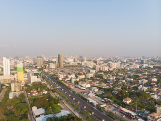 Aerial view office building with city road morning sun rise
