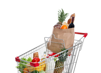 Shopping cart with groceries on white background