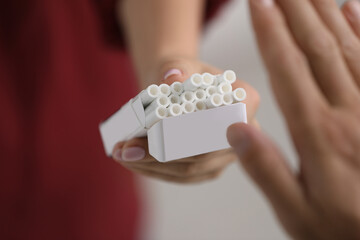 Stop smoking concept. Man refusing cigarettes, closeup