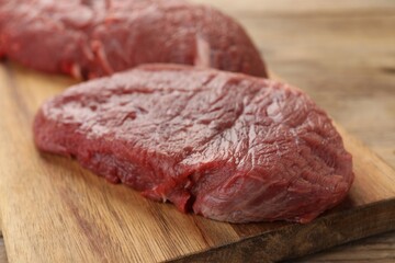Pieces of raw beef meat on table, closeup