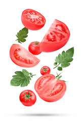 Naklejka premium Fresh ripe tomatoes and green leaves falling on white background
