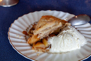 Slice of homemade gourmet apple pie on a holiday table