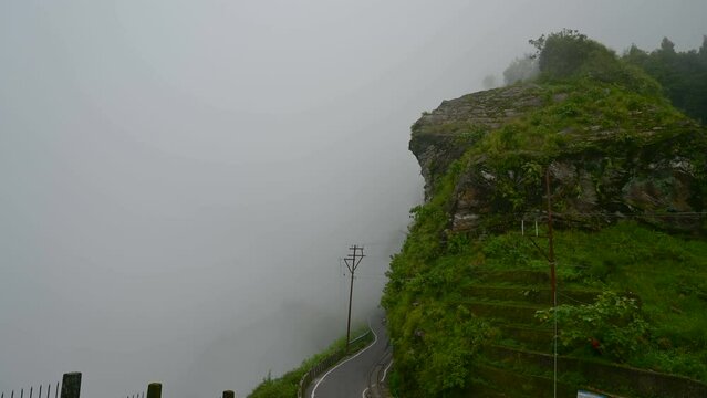 Timelapse video of monsoon clouds passing over Himalayan mountains of Darjeeling, West Bengal, India. Darjeeling is queen of hills and very scenic with beautiful green hills in rainy season.