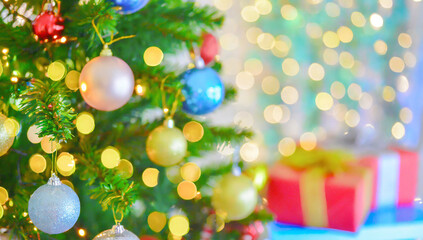 In home christmas tree and gift defocused bokeh and blur christmas tree background