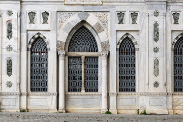 part wall of Bayezid mosque with antique windows - one of the oldest mosques in Istanbul