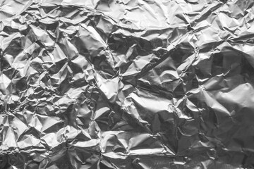 Shiny metal silver gray foil crumpled texture background