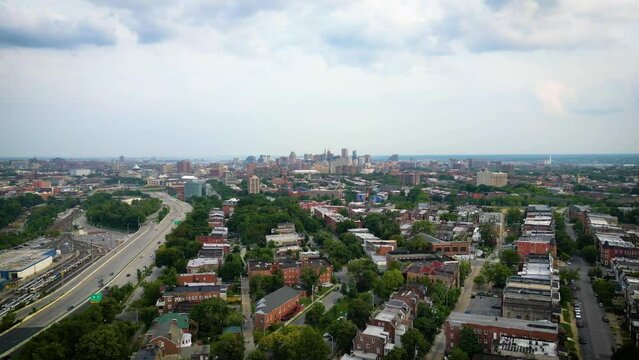 Aerial footage of the cityscape of Baltimore with overcast sky in the background in Maryland, USA