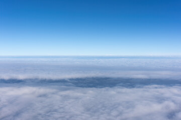 Passenger plane sailing on the sea of clouds