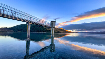 Fototapeta premium Amazing vibrant sunrise colours over Lake Tekapo