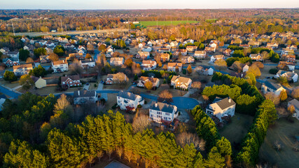 Aerial panoramic view of an upscale subdivision with housing cluster in suburbs of USA shot during...