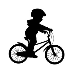 Kid riding bicycle silhouette, little kid having fun by riding bicycle. Cute kid in safety helmet biking outdoors