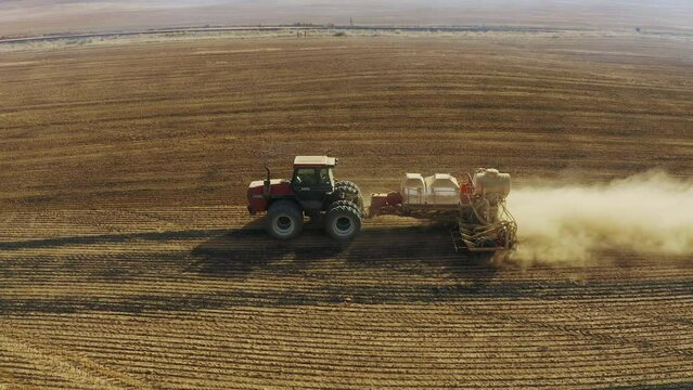 Cereal farm field, tractor plow or drone perspective view of machine sustainable farming of land resources, plantation or crop. Agriculture, soil and vehicle for countryside agribusiness supply chain