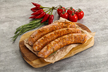 Raw sausages with spices and herbs