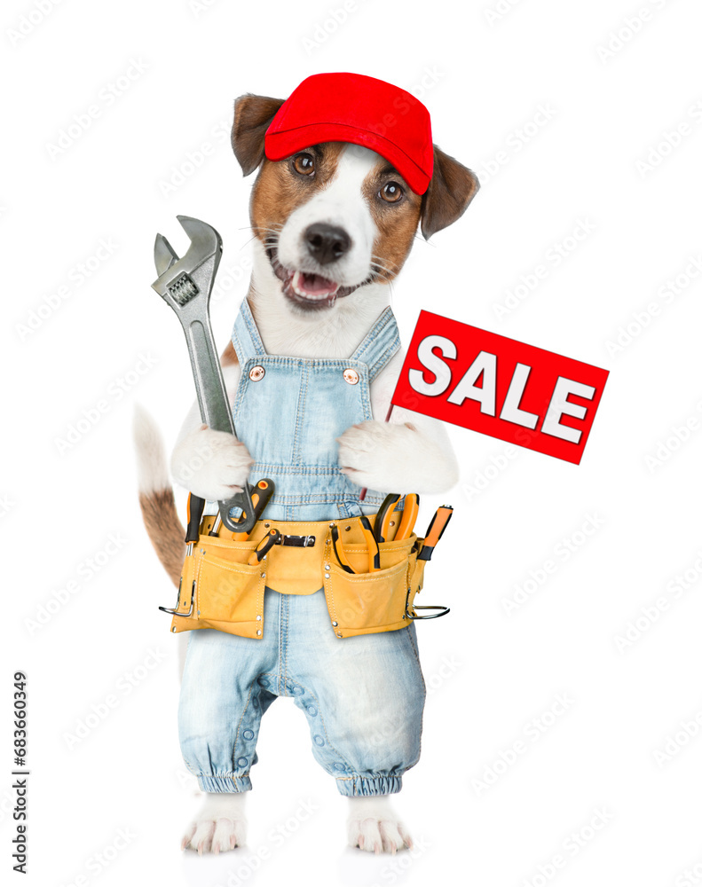 Poster funny puppy wearing red cap and denim overalls with tool belt holds adjustable wrench shows signboar