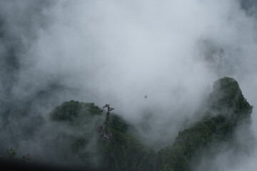 cable car in the fog ,smoke, mist landscape mountain on the clouds 
