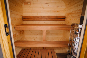 Small home wooden sauna, spa room. Relax in a hot sauna.