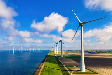Windmill turbines Park with a blue sky, and windmill turbines park in the ocean. Netherlands Europe...
