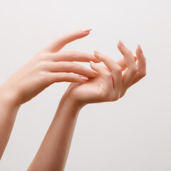 woman hands applying moisturizing cream to her skin