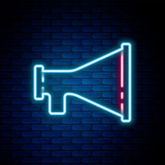 Glowing neon line Megaphone icon isolated on brick wall background. Speaker sign. Colorful outline concept. Vector