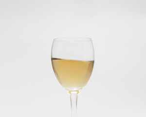 front view of white wine glass isolated on white background
