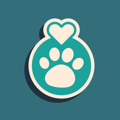 Obraz premium Green Heart with animals footprint icon isolated on green background. Pet paw in heart. Love to the animals. Long shadow style. Vector
