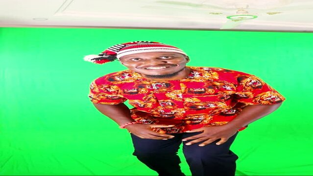 Cautious and happy approach to secretly release a good news dressed in an Igbo tribe, African  representative of Santa Claus