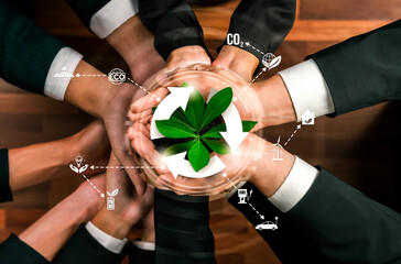 Business partnership holding plant together with recycle icon symbolize ESG sustainable environment...