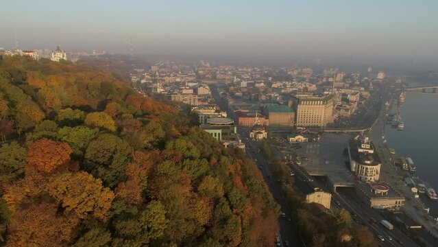 Sunrise golden  autumn aerial drone panorama of a Dnieper, Poshtova square and Volodymyr monument in Kyiv, Ukraine