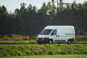 Commercial van on the road. Delivery van close-up mockup isolated. Final destination shipping truck...