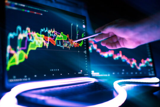 Business trend, market analysis on a tablet against the background of charts