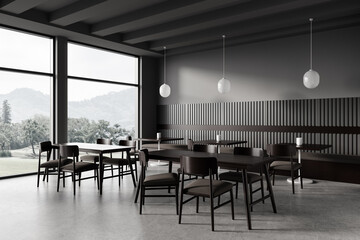 Stylish cafe interior with table and seats, dining space near panoramic window