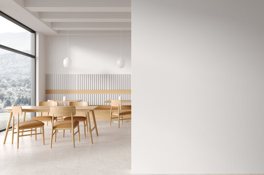White cafe interior with blank wall