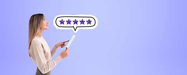 Woman with tablet and five star rating