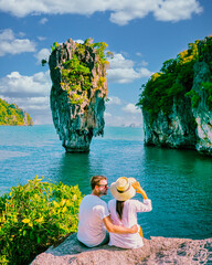 James Bond Island Phangnga Bay Thailand, couple visit the Island near Phuket Thailand, men and women on a boat trip at Phangnga Bay Thailand - obrazy, fototapety, plakaty