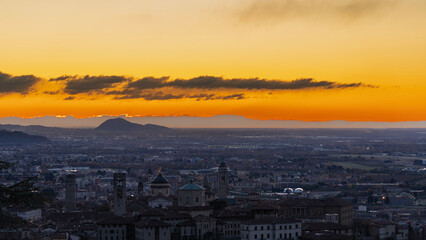 Bergamo, Italy. One of the beautiful city in Italy. Morning landscape at the old town from Saint Vigilio hill during fall season. Orange and red contest